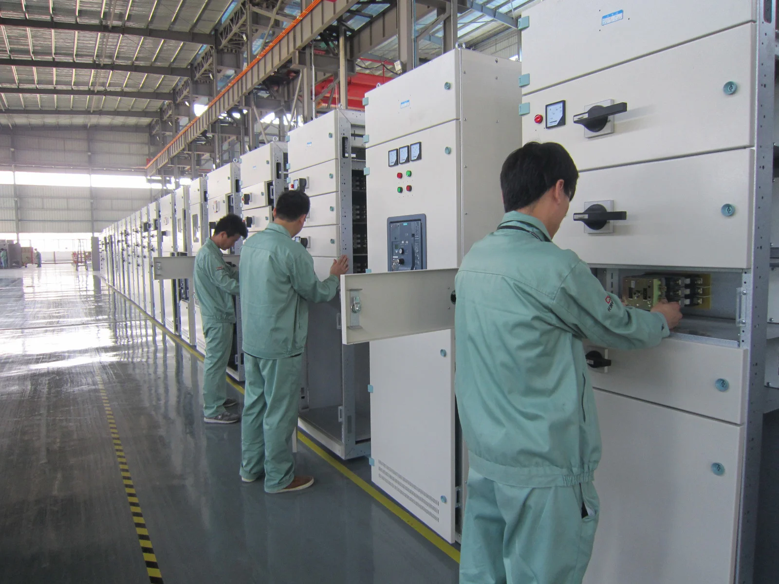 Technicians assembling switchgear at CMC Electric workshop